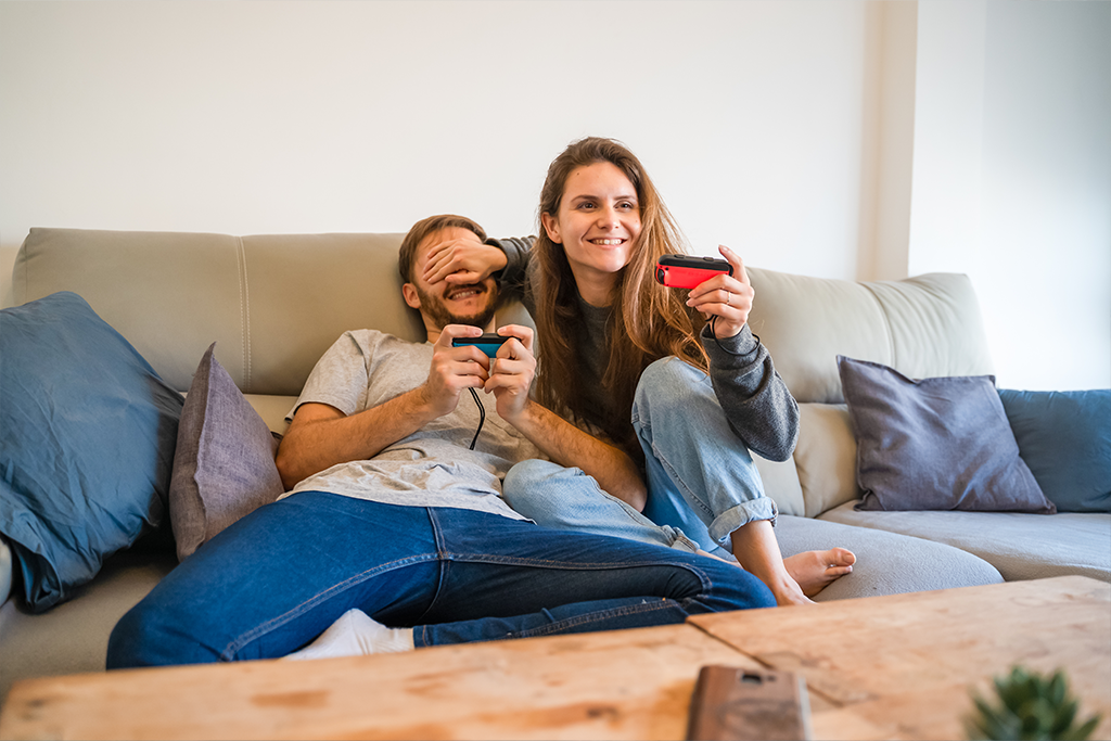 A couple playing on their Switch