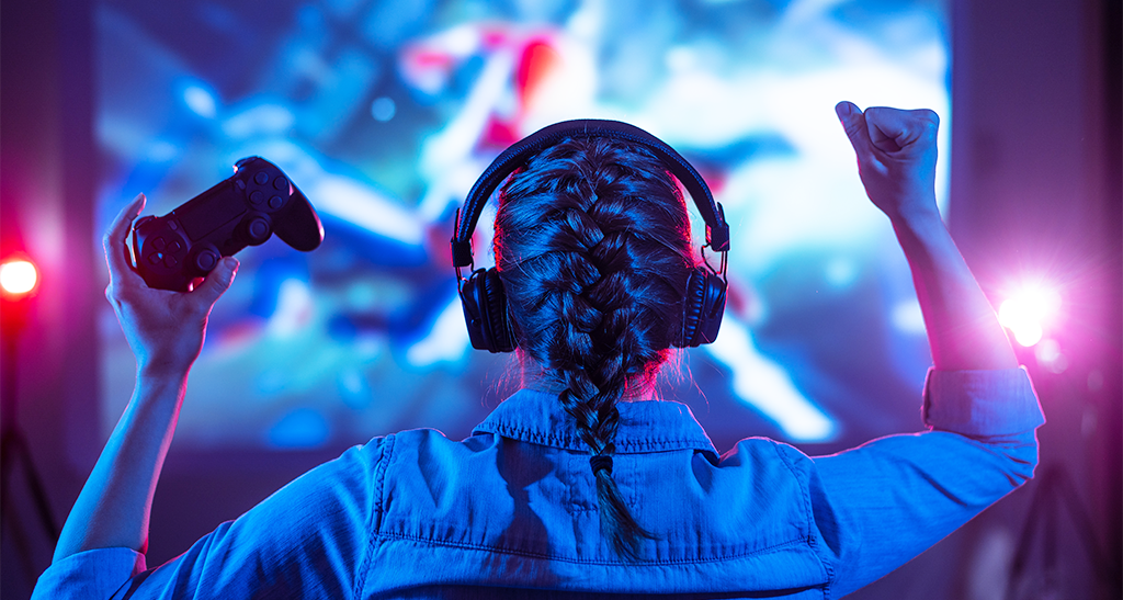 Girl playing video games in her room using wi-fi to play her games