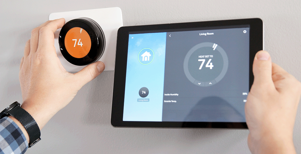 Someone setting their heating using smart home apps connected to the wi-fi