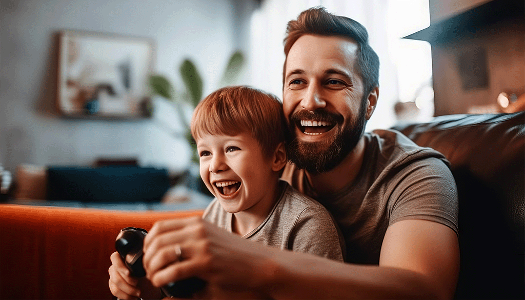 Father and son playing online games using broadband