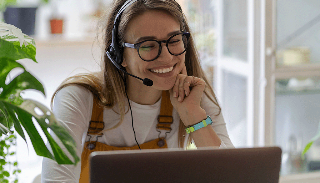 Young woman on a works call using he broadband